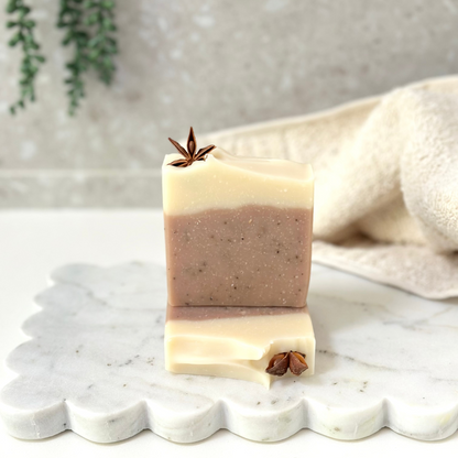 Bar of soap with star anise on a marble surface